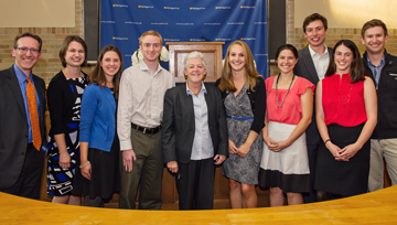 EPA Administrator Gina McCarthy (center) poses with Prof. David Uhlmann (left) and students during a 2013 visit to the School.