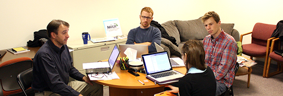 MiUI General Manager Steve Gray meets with Michigan Law students Gordon Kangas, David Hamstra, and Karima Tawfik.