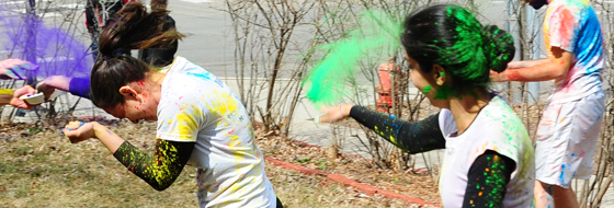 Students celebrate Holi, the Indian festival of colors.