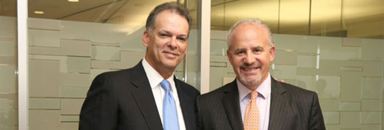 Carl Valenstein, right, receiving his award with Jay Zimmerman