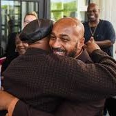 Keith Bush hugs a supporter after his conviction was overturned.