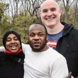 https://www.law.umich.edu/special/exoneration/PublishingImages/Rafiq_Dixon%20with%20family%20and%20Cooley.jpeg